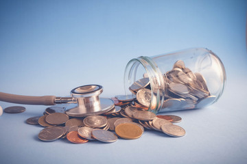 save money for investment concept Stethoscope and money  with filter effect retro vintage style