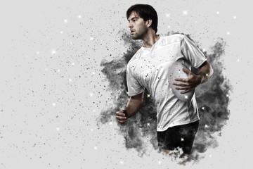 Rugby player coming out of a blast of smoke.