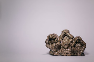 composition Statue of three monkey emotions figure on white background