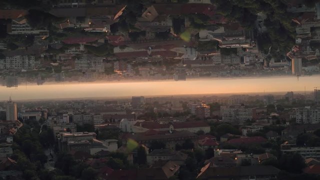 Upside down city digital composite aerial footage with some lens flare in 4k ultra HD