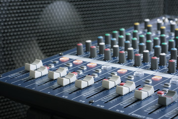 Fototapeta premium Professional Music Mixer Console with dial knob and slide bar. Professional music recording equipment.