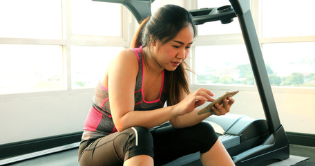 Young asian woman with mobile phone