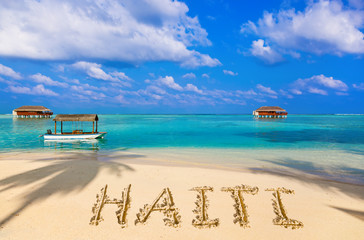 Fototapeta na wymiar Word Haiti on beach