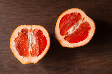 Cut grapefruit on a dark table