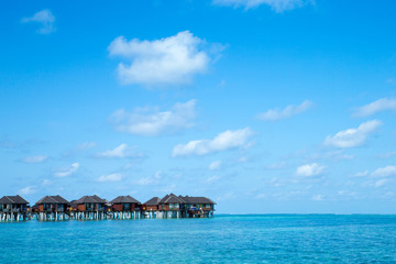 beach with water bungalows at Maldives