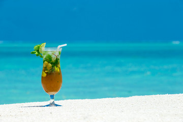cocktail with blur beach on background