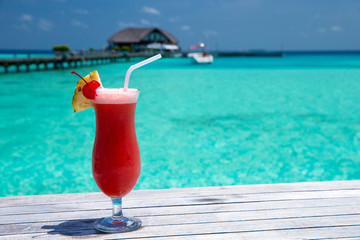 cocktail with blur beach on background
