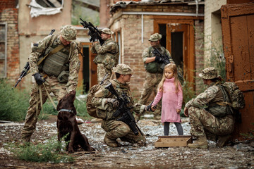 Rangers and children on battlefield background. Military and rescue operation concept...