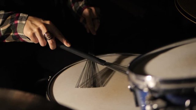 Drumming On Snare With Brushes Close Up Slowmotion. footage of two drum sticks hitting a snare drum.