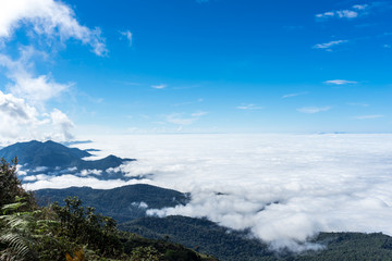 Mist over the mountains with blue sky background at doi inthanon. thailand