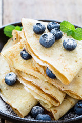 Crepes served with fresh blueberries and powdered sugar