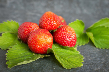 Juicy red strawberries on a plate