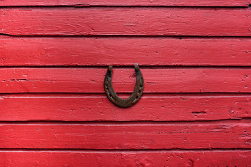 Horseshoe on the red wall