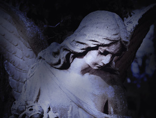 angel of death as a symbol of the end of life (ancient statue)