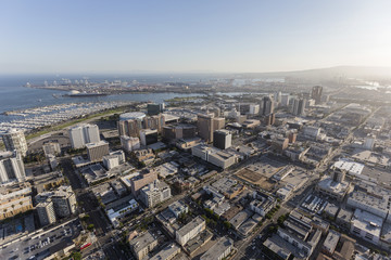  Aerial view of downtown streets, buildings and coastline in Long Beach, California.   