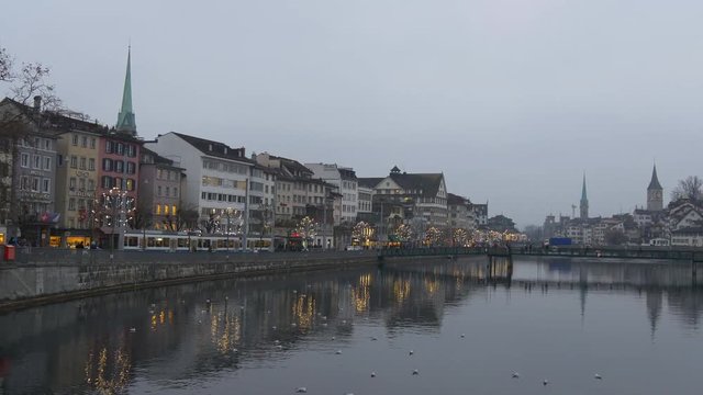 twilight zurich city famous riverside cityscape bridge panorama 4k switzerland

