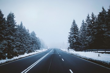 View of empty road on snowy landscape
