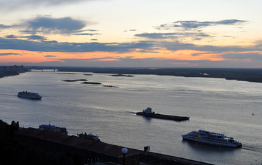 Ships on the Volga River in Nizhny Novgorod during sunset.