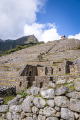 Fototapeta na wymiar Terraces at Machu Picchu Inca Ruins - Sacred Valley, Peru