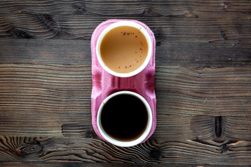 Coffee take away. Coffee cups with covers on wooden table backound top view copyspace