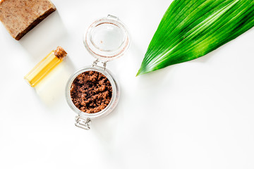 Composition of spa treatment, Coffee scrub, coffee soap and oil on white background top view copyspace