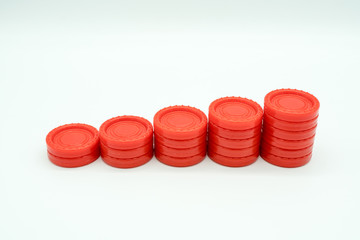 Row of coin rising stacks isolated on white