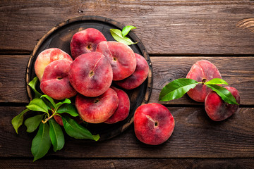 Peach, saturn or donut peaches with leaves © Sea Wave