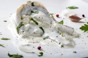 Herring fillets in mayonnaise sauce with herbs