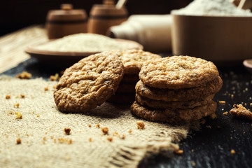 Biscuit sweet cookie background. Domestic stacked butter biscuit pattern concept,close up macro.Homemade cookies on wooden table.Cereal biscuits with the sesame,peanuts,sunflower and amaranth.