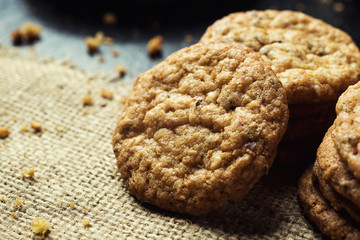 Biscuit sweet cookie background. Domestic stacked butter biscuit pattern concept,close up macro.Homemade cookies on wooden table.Cereal biscuits with the sesame,peanuts,sunflower and amaranth.