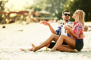 Happy couple having fun on the beach. Fun, summer, love concept.