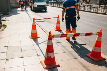 Obraz premium Road worker. Road cone on the road. Road sign. Road works on the streets of Istanbul in Turkey. Sign. Road traffic.