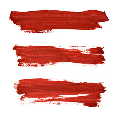 Brush strokes of red acrylic paint