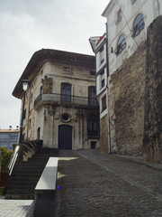 Fototapeta na wymiar El Palacio Montalivet construido en el siglo XVIII es un edificio de aspecto señorial con un escudo de armas en Mutriko , en la costa del País Vasco, España, en la primavera de 2017