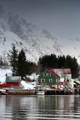 Red-green-white cottages in Vestpollen over Austnesfjorden-Austvagoya island. Lofoten-Nordland fylke-Norway. 0098