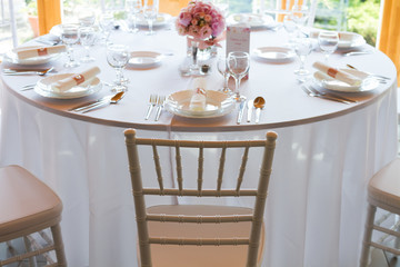 table setting with spoon, knife, plates and glass