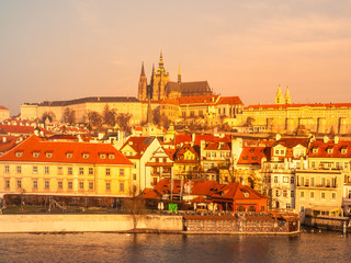 Fototapeta na wymiar Prague Castle and Vltava River illuminated by golden sunrise, Prague, Czech Republic.