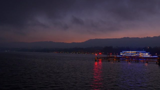 night twilight sky zurich famous lake ferry bay panorama 4k switzerland 
