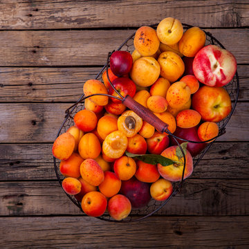 Apricots, Fruits in a metal basket on a vintage wooden background.Food or Healthy diet concept.Super Food.Vegetarian.Top View.Copy space for Text.selective focus.