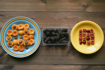 macro pattern from apricots and cherries on a plates