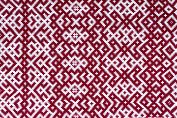 Knitted texture with the pattern of National symbol of Latvia - Lielvardes (place in Latvia) belt that is one of the most magnificent Latvian symbols. Latvian traditional historical ornaments.