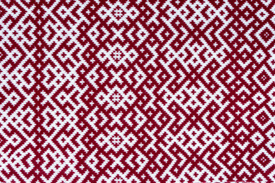 Knitted texture with the pattern of National symbol of Latvia - Lielvardes (place in Latvia) belt that is one of the most magnificent Latvian symbols. Latvian traditional historical ornaments.