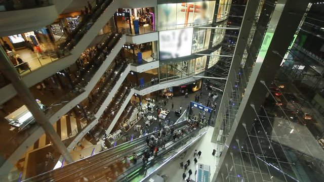 Crowd moving inside modern building, time lapse