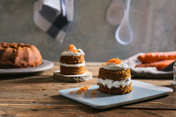 Mini carrot cake, stuffed with cream cheese, on blue concrete dish
