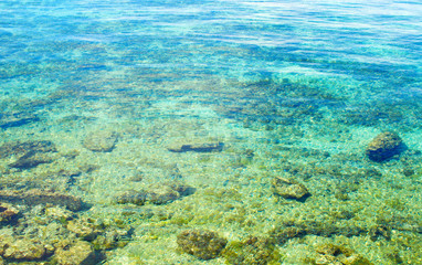 Turquoise blue sea on white coral seashore. White beach of tropical island.