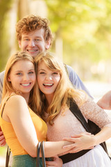 Fototapeta premium Three happy young people friends outdoor.