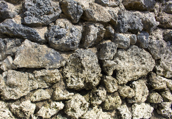 Natural stone background. Rustic old wall wallpaper. Rough grey stone bricks design.