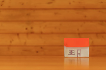 paper houses stands over a wooden background