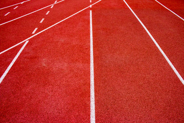 Red running track Synthetic rubber on the athletic stadium.