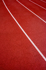 Red running track Synthetic rubber on the athletic stadium.